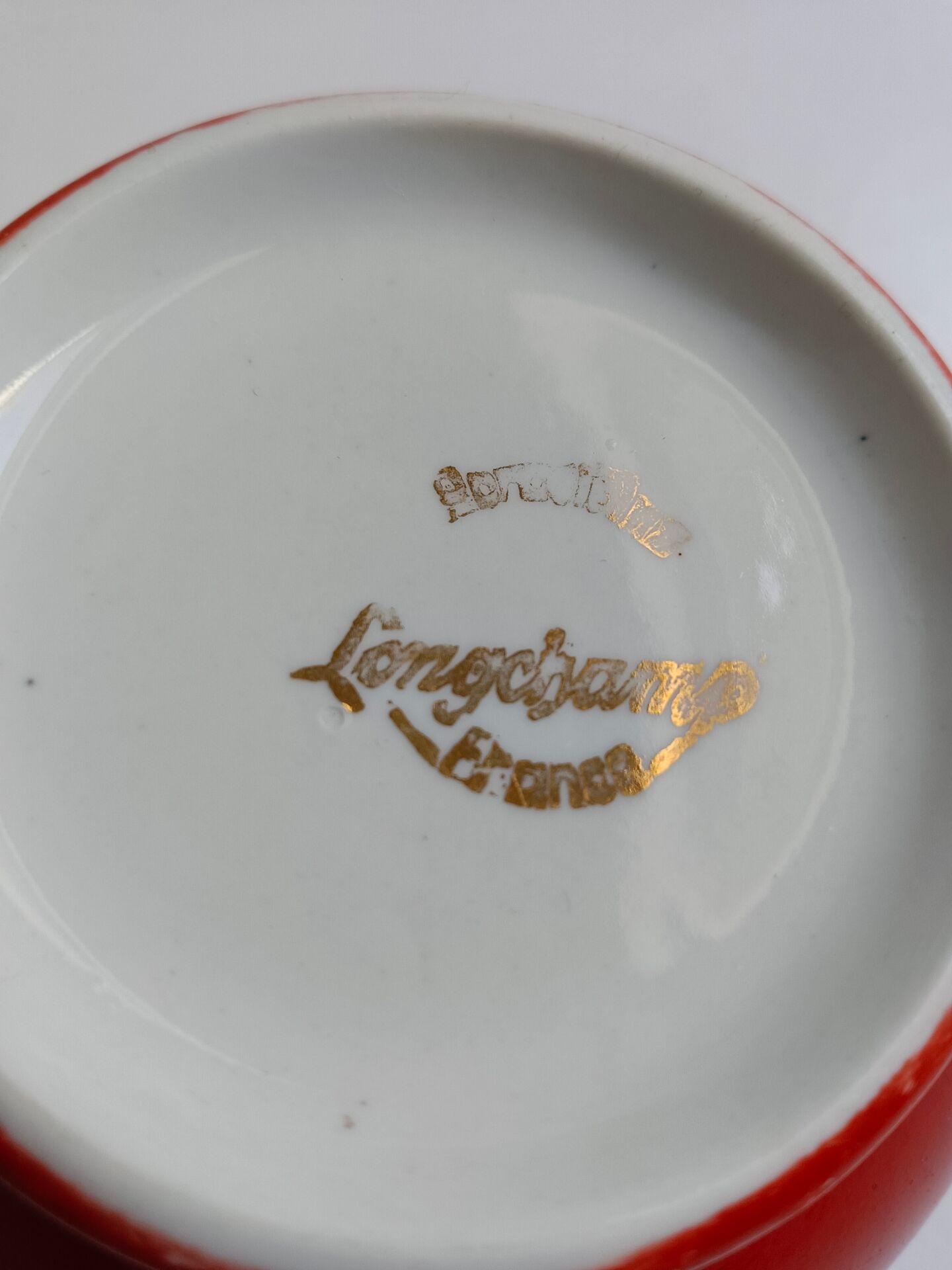 Red bowl with white polka dots in Longchamp ceramic