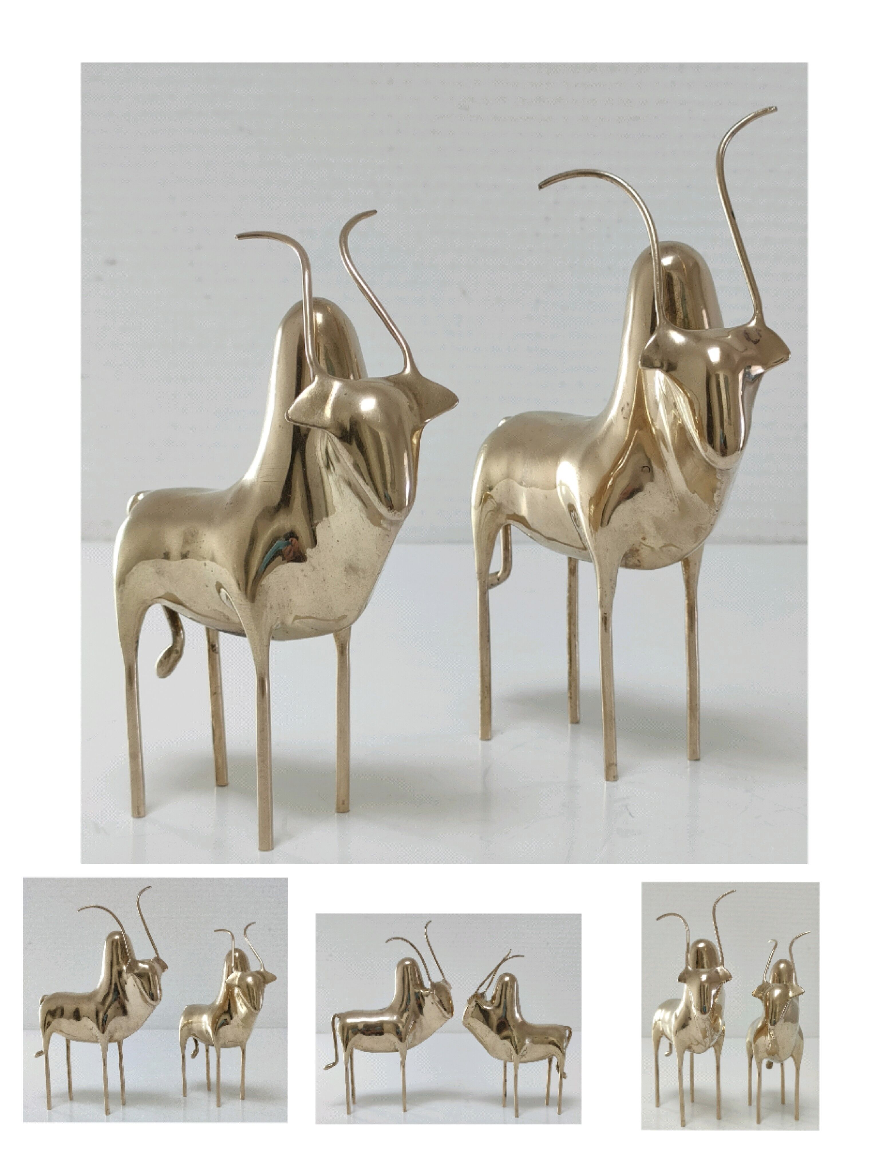Two stylized zebu with long vintage brass horns