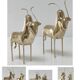 Two stylized zebu with long vintage brass horns