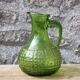 Antique vintage pitcher in green molded glass with floral relief - retro decoration