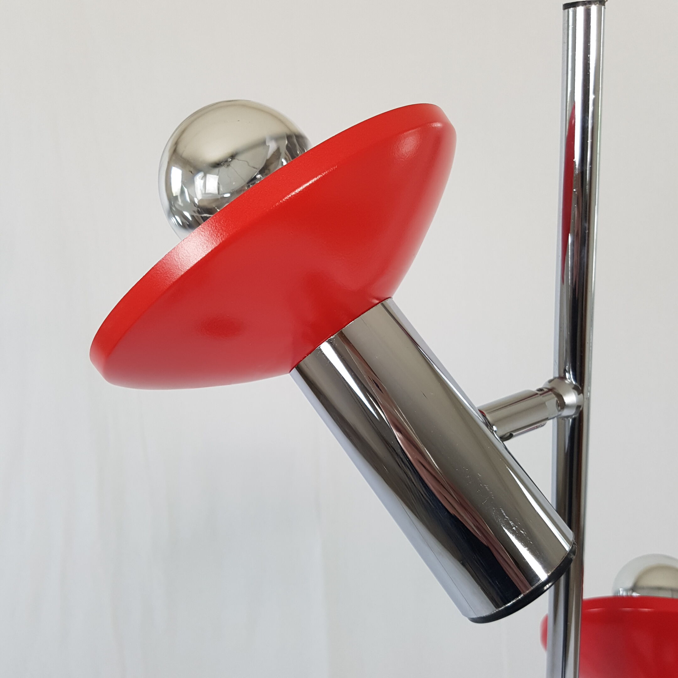 Two red lights and chrome floor lamp