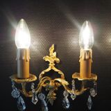 Pair of gilded bronze sconces and crystal pendants