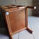 Shelf selette on wooden feet and vintage rattan