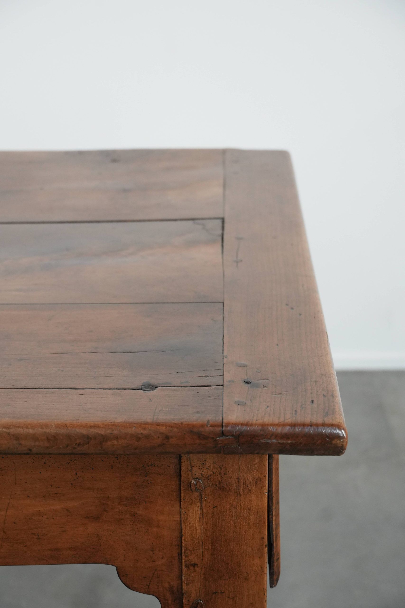 Elegant and subtle antique French dining table made of fruitwood