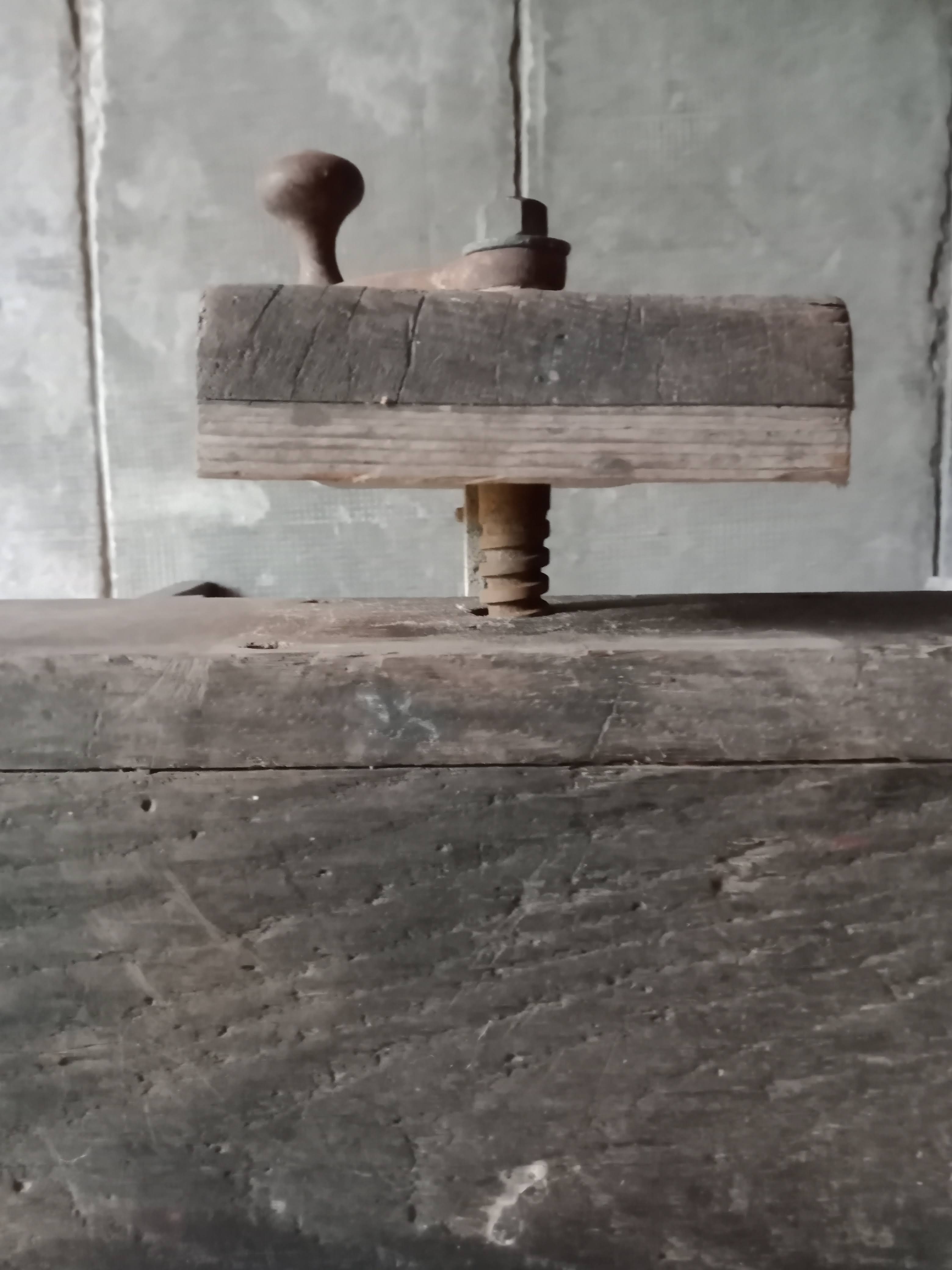 antique workbench with one drawer and two vices