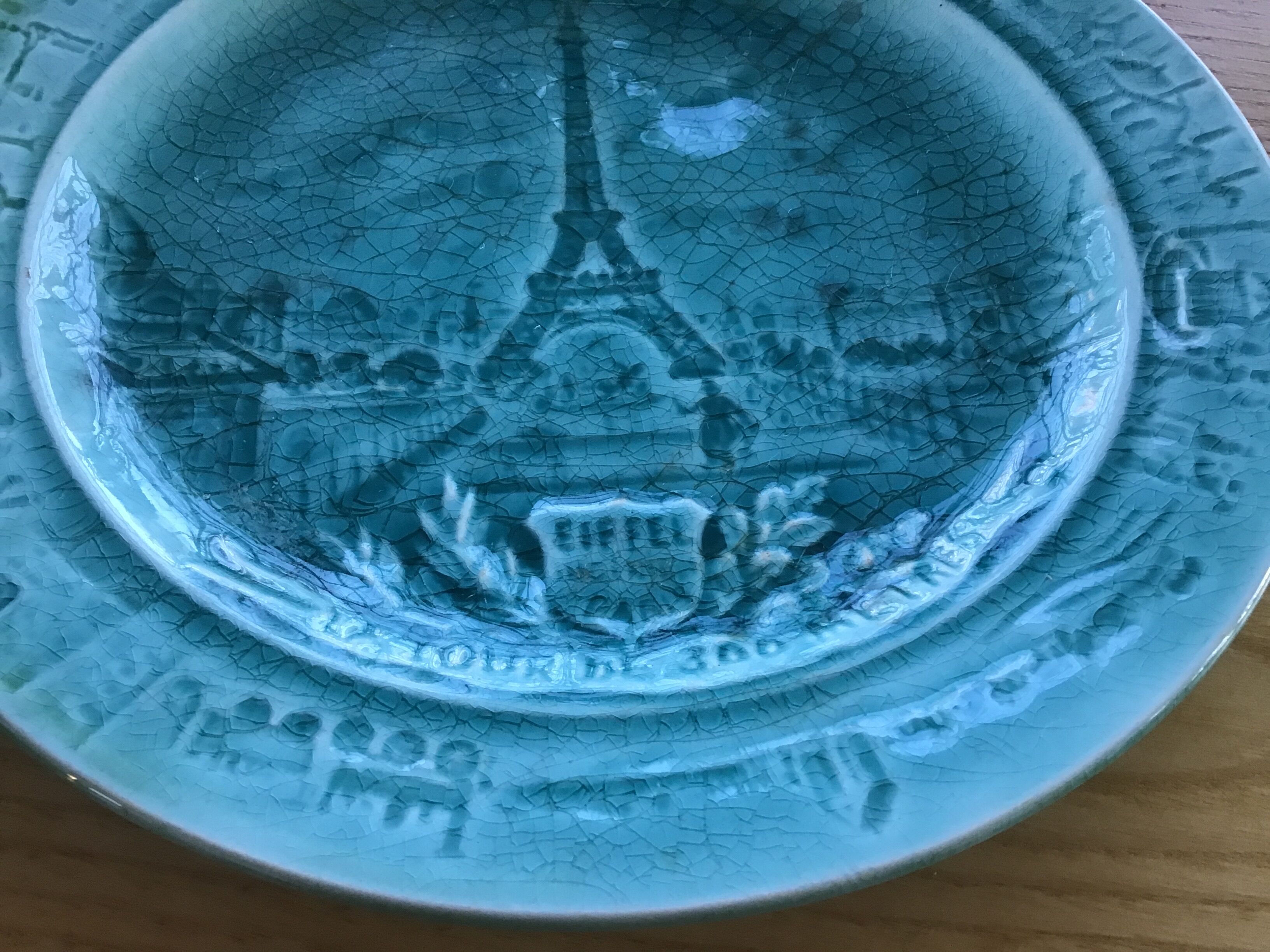 Cracked earthenware plate the Eiffel Tower