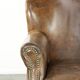 Robust cowhide armchair in a beautifully subtle size with a wonderful patina.
