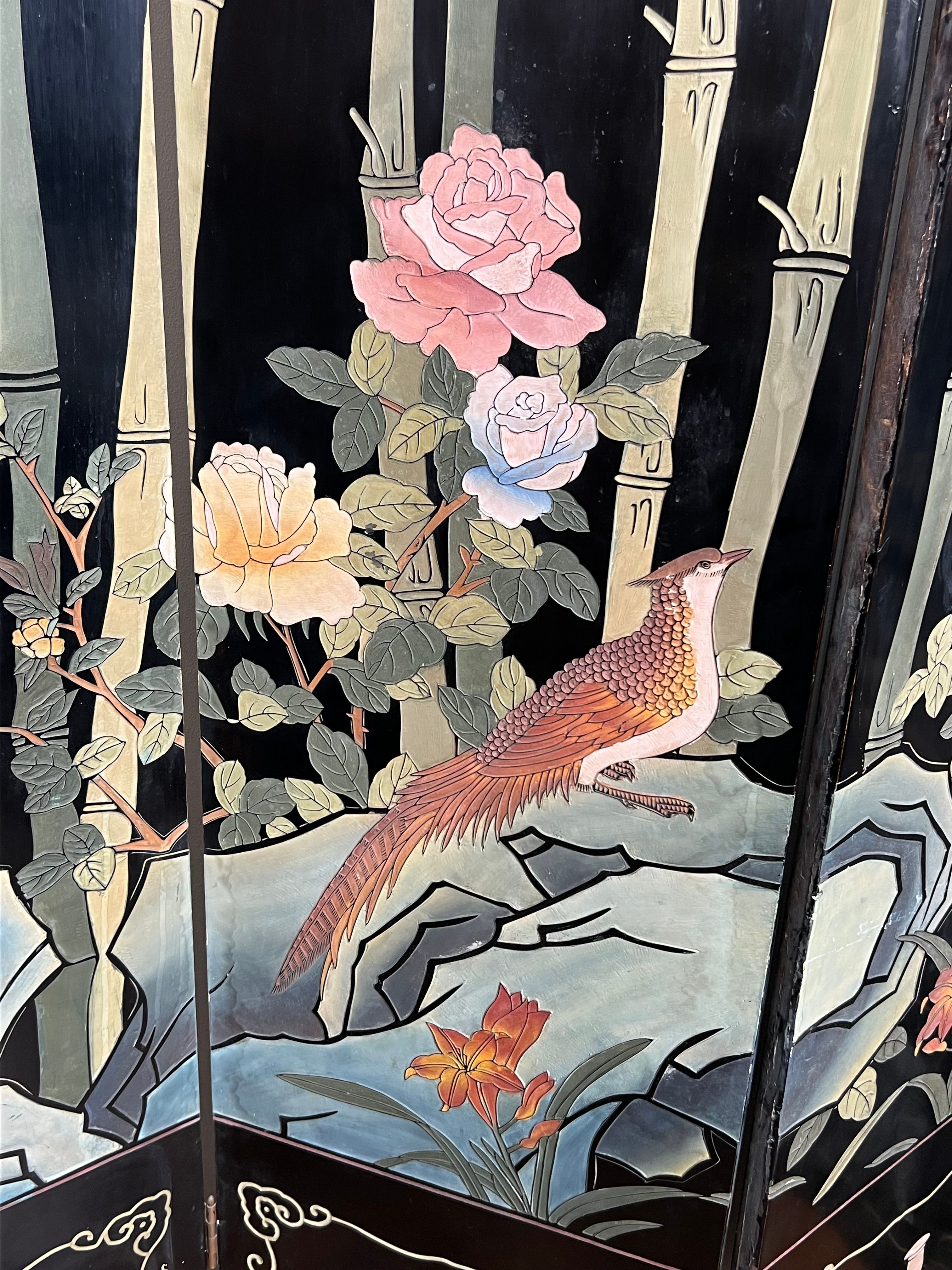 Chinese lacquered screen with decorations of birds and bamboo. Chinese work. Around 1950.