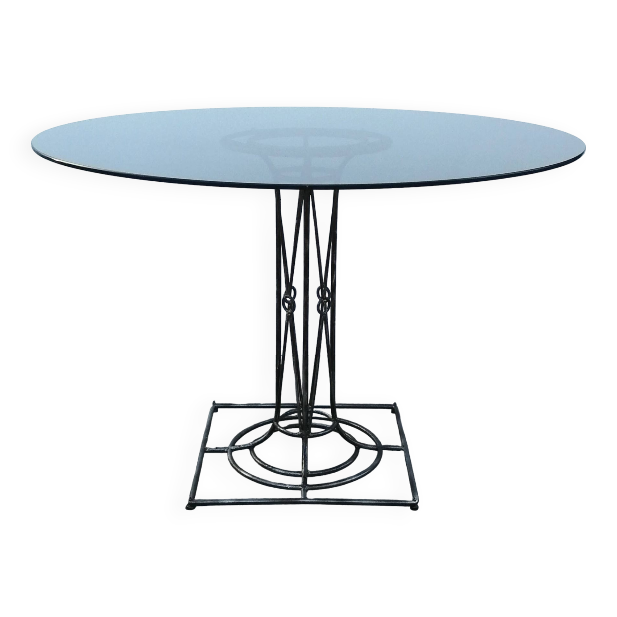 Wrought iron dining table with its round smoked glass top, vintage 1980