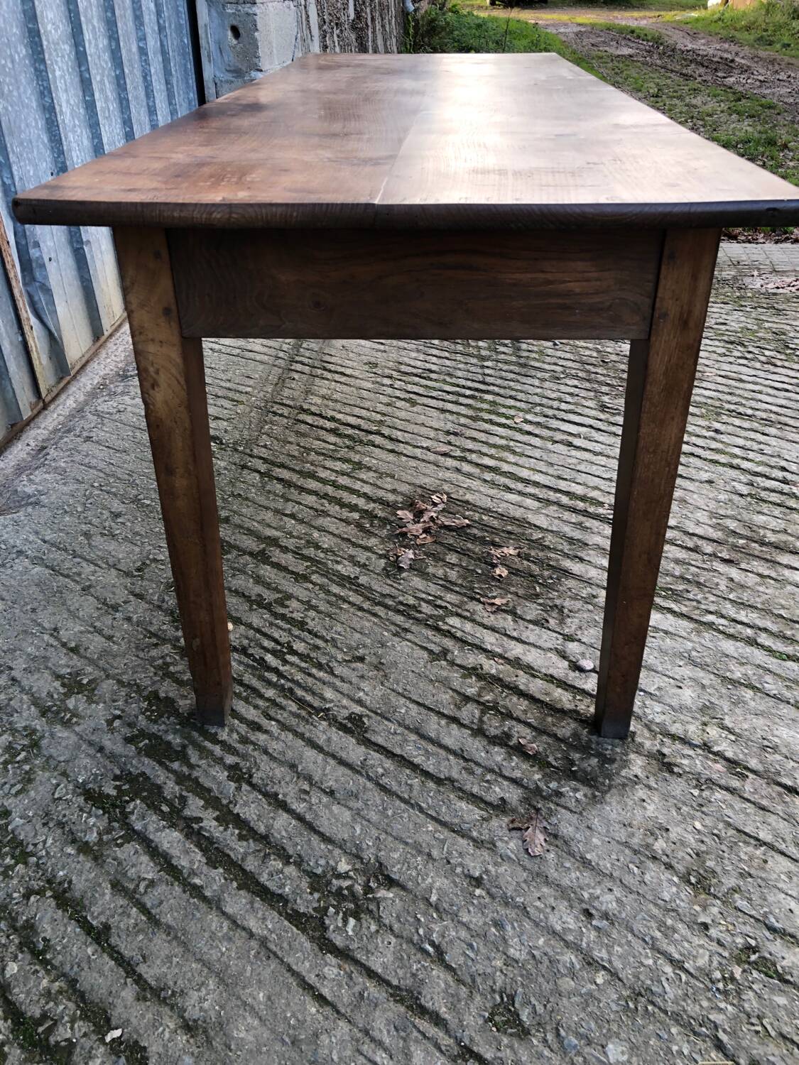 Antique chestnut farmhouse table with 3 drawers on the front.