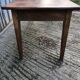 Antique chestnut farmhouse table with 3 drawers on the front.