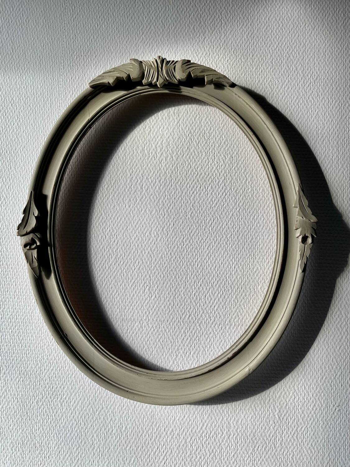 Oval frame in weathered wood