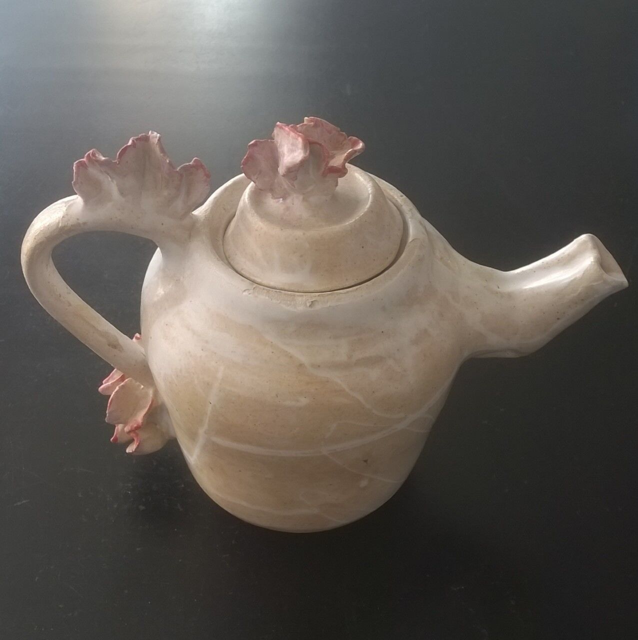Vintage teapot with relief coral decoration.