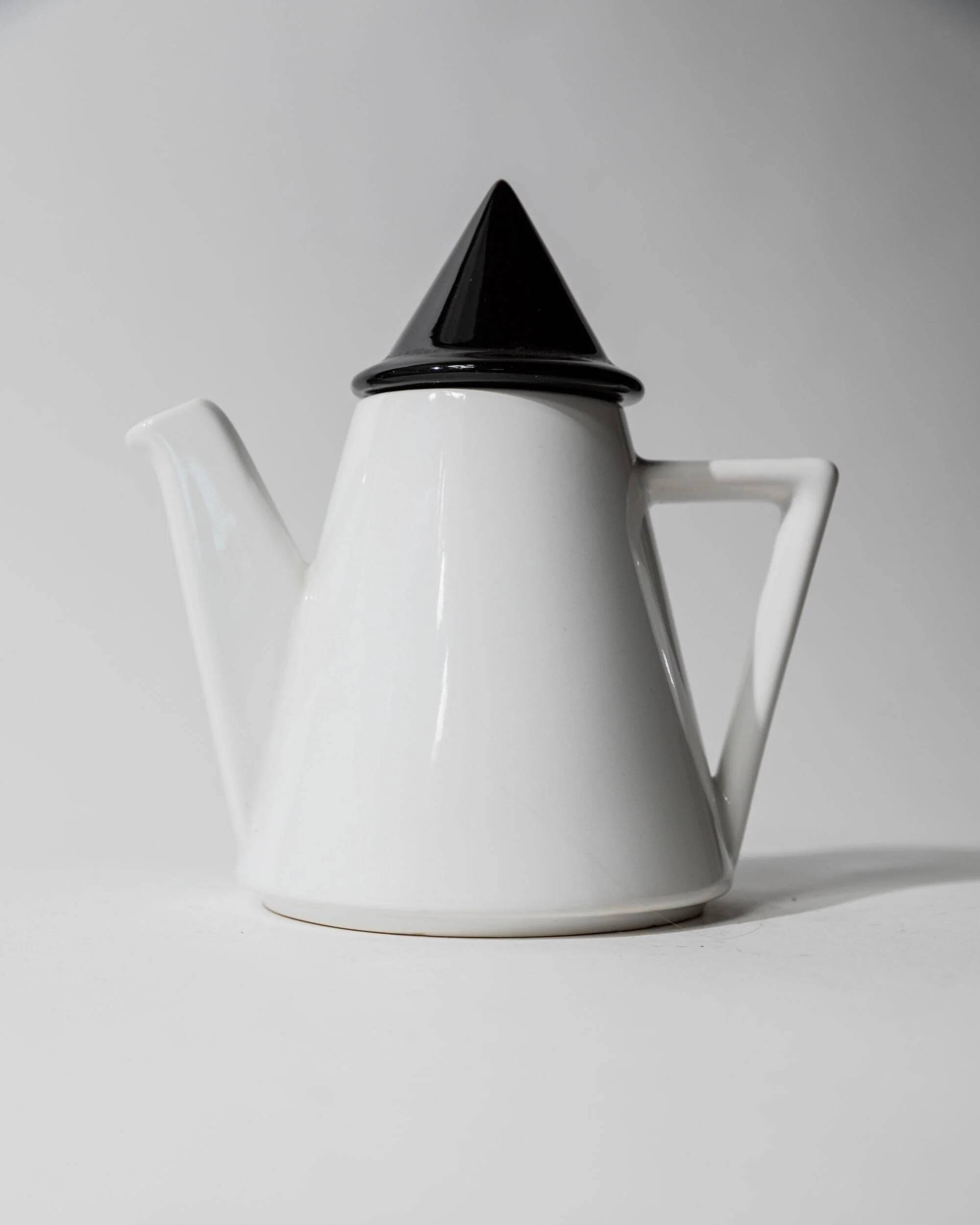 Vintage ceramic coffee pot or teapot from the 1980s, postmodern Memphis design, black and white triangles.