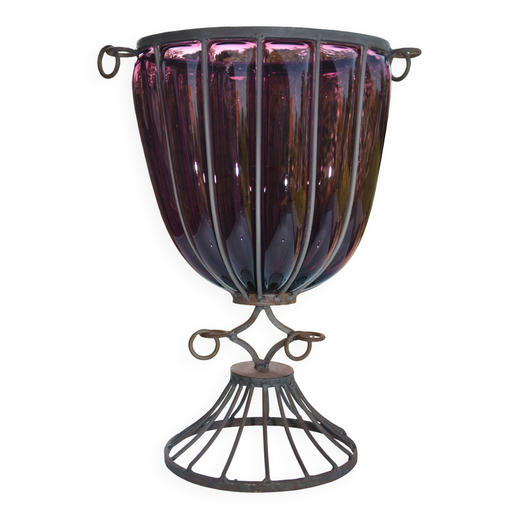 Large blown glass and wrought iron vase on shower stand