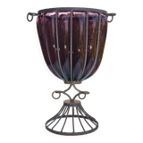 Large blown glass and wrought iron vase on shower stand