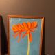 2 paintings of orange dahlias in antique wooden frames