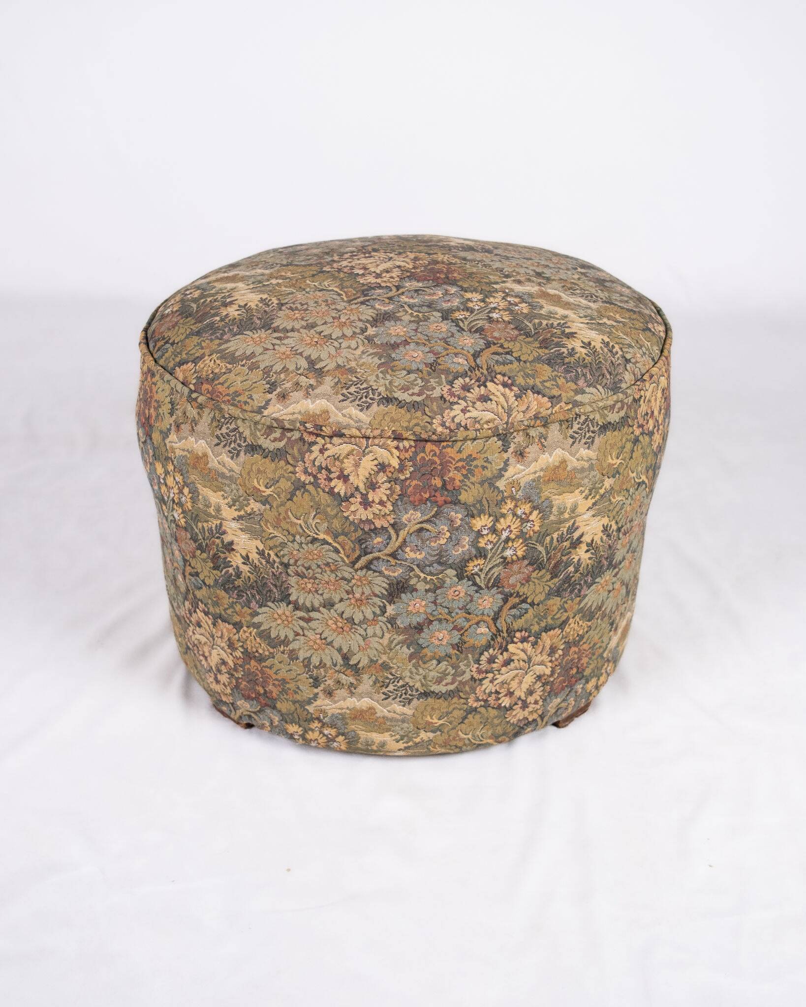 Upholstered pouf in verdure tapestry style, France, late 19th century.
