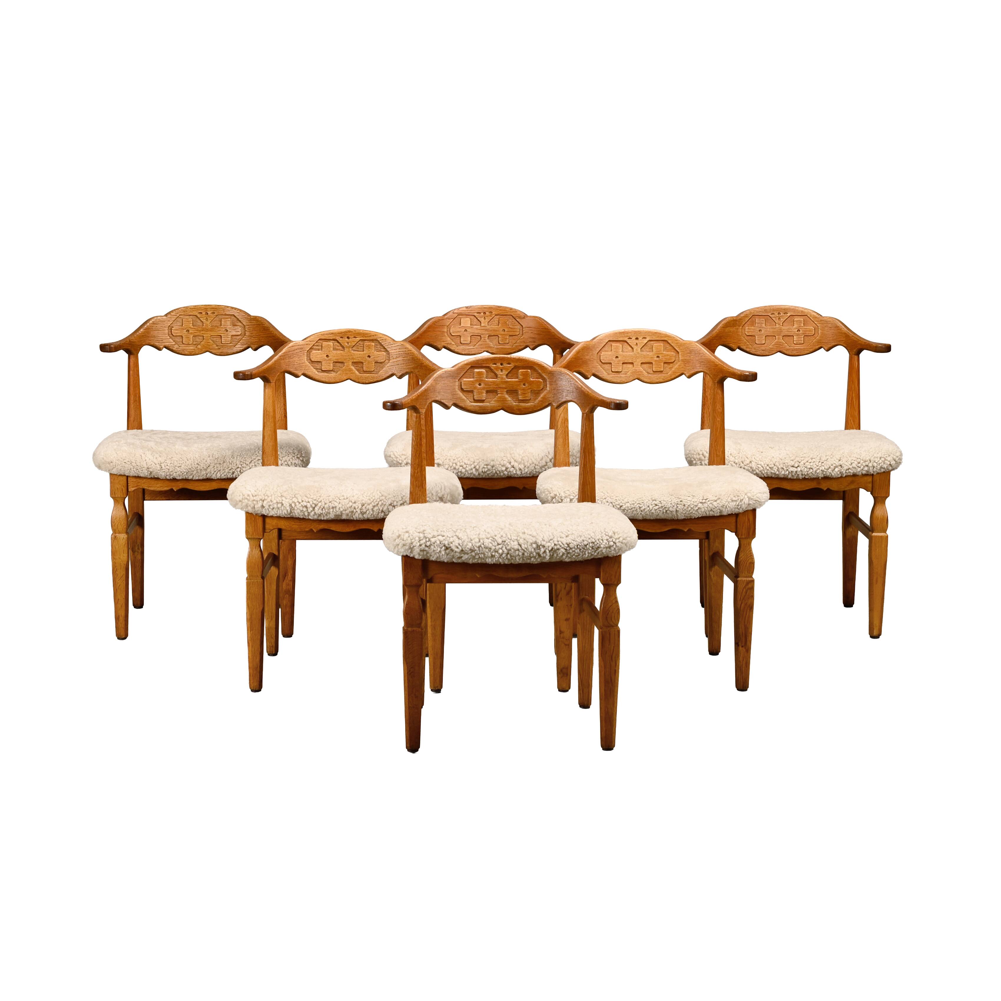 Henning Kjærnulf brutalist dining chairs set in Oak and Sheepskin, Denmark