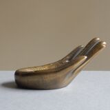 Empty-pocket brass hand