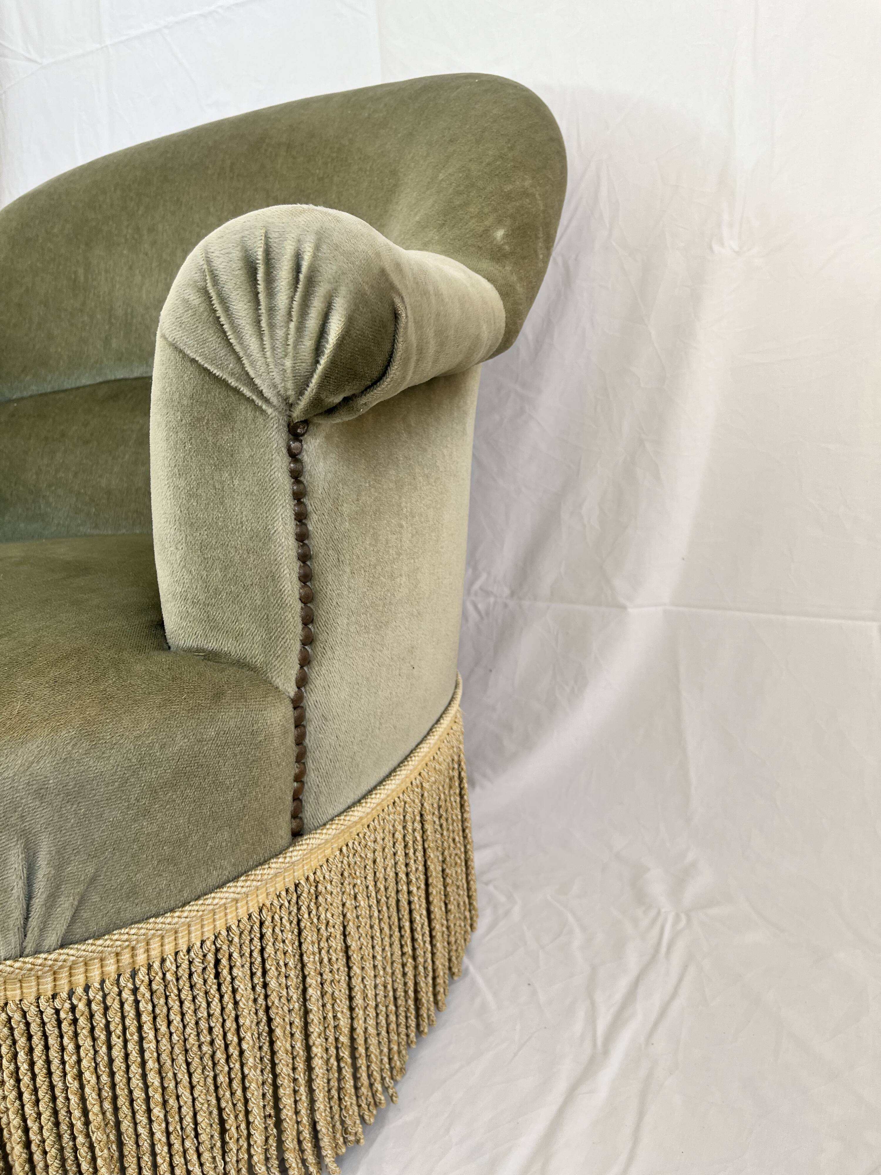 sage green toad armchairs with gold fringe