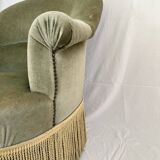 sage green toad armchairs with gold fringe
