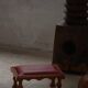 Danish sculpted oak stool from the mid-20th century with a red leather seat, 1950s.