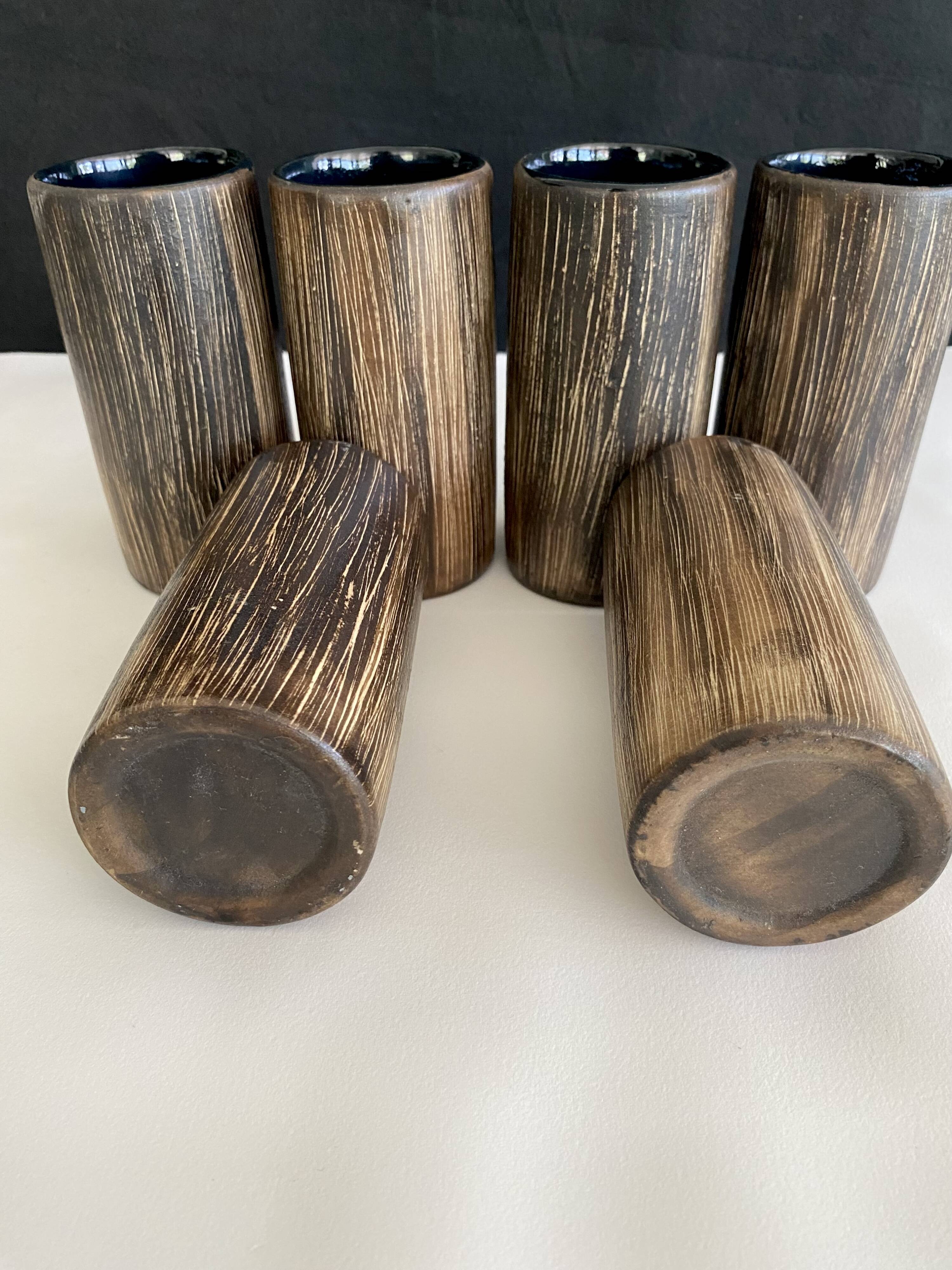 Six terracotta glasses, matt and glazed