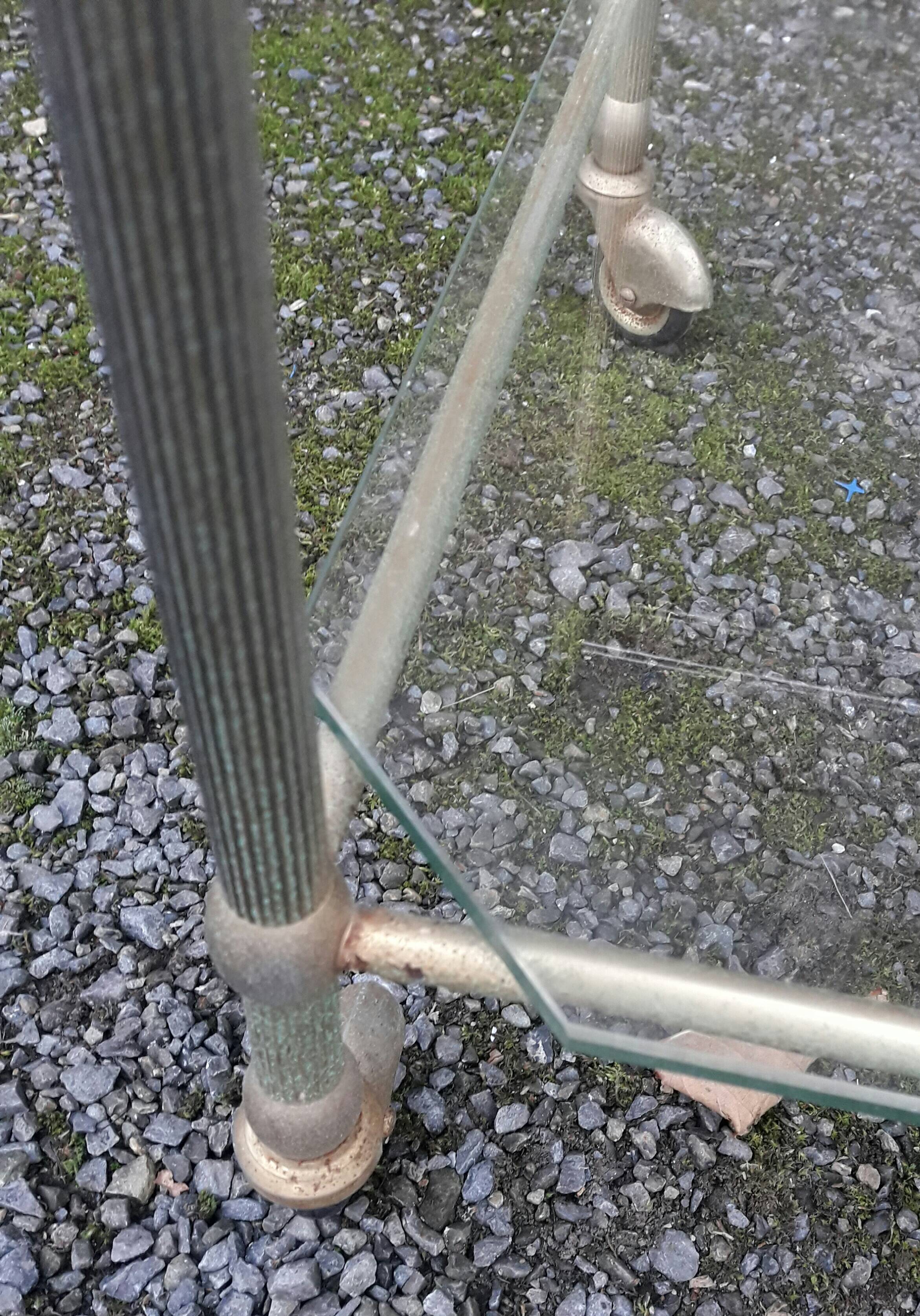Small rolling table in glass and gold metal