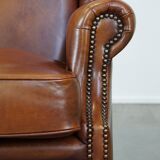 Fauteuil à oreilles en cuir de vachette cognac