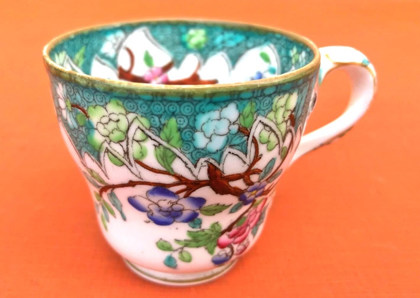 Antique porcelain cup in the Minton style with Japanese decoration.