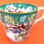 Antique porcelain cup in the Minton style with Japanese decoration.