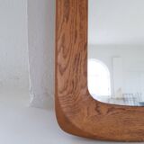 Mid-century modern sculptural wall mirror in stained oak, glass, Glas & Trä 1959