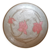 Enamelled brass stand with floral decoration.