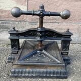 Old printing press in very old cast iron