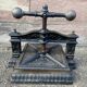 Old printing press in very old cast iron