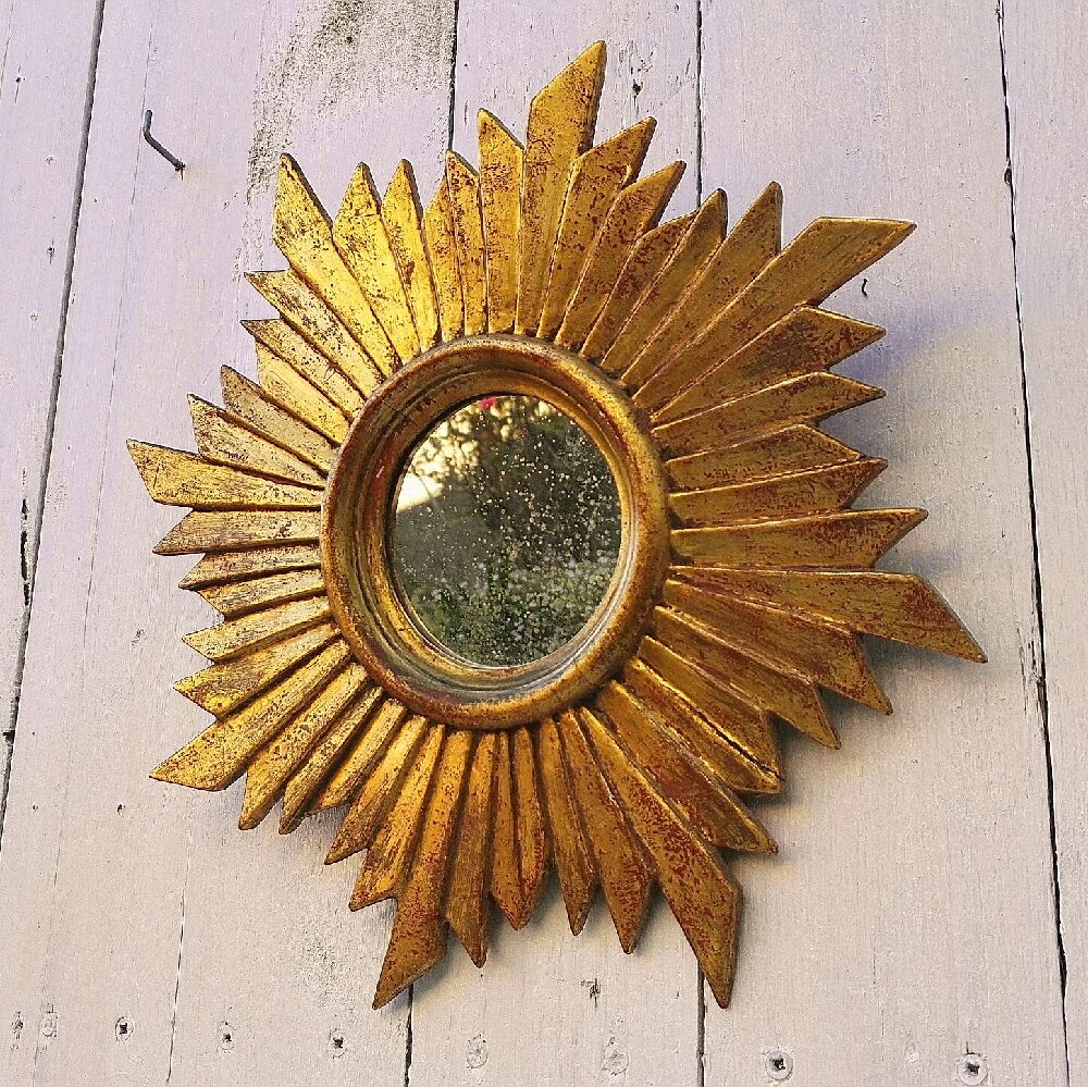 Sun mirror in gilded wood vintage decoration
