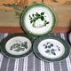 Antique earthenware plates with fruit decoration.