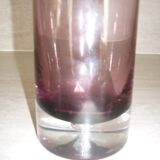 Plum-colored glass bottle with bubble