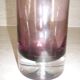 Plum-colored glass bottle with bubble