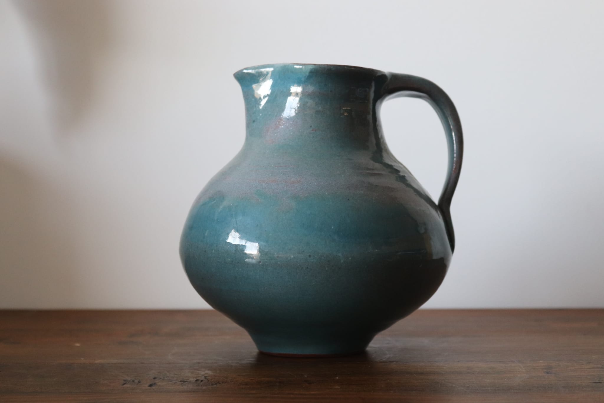 Varnished blue terracotta pitcher