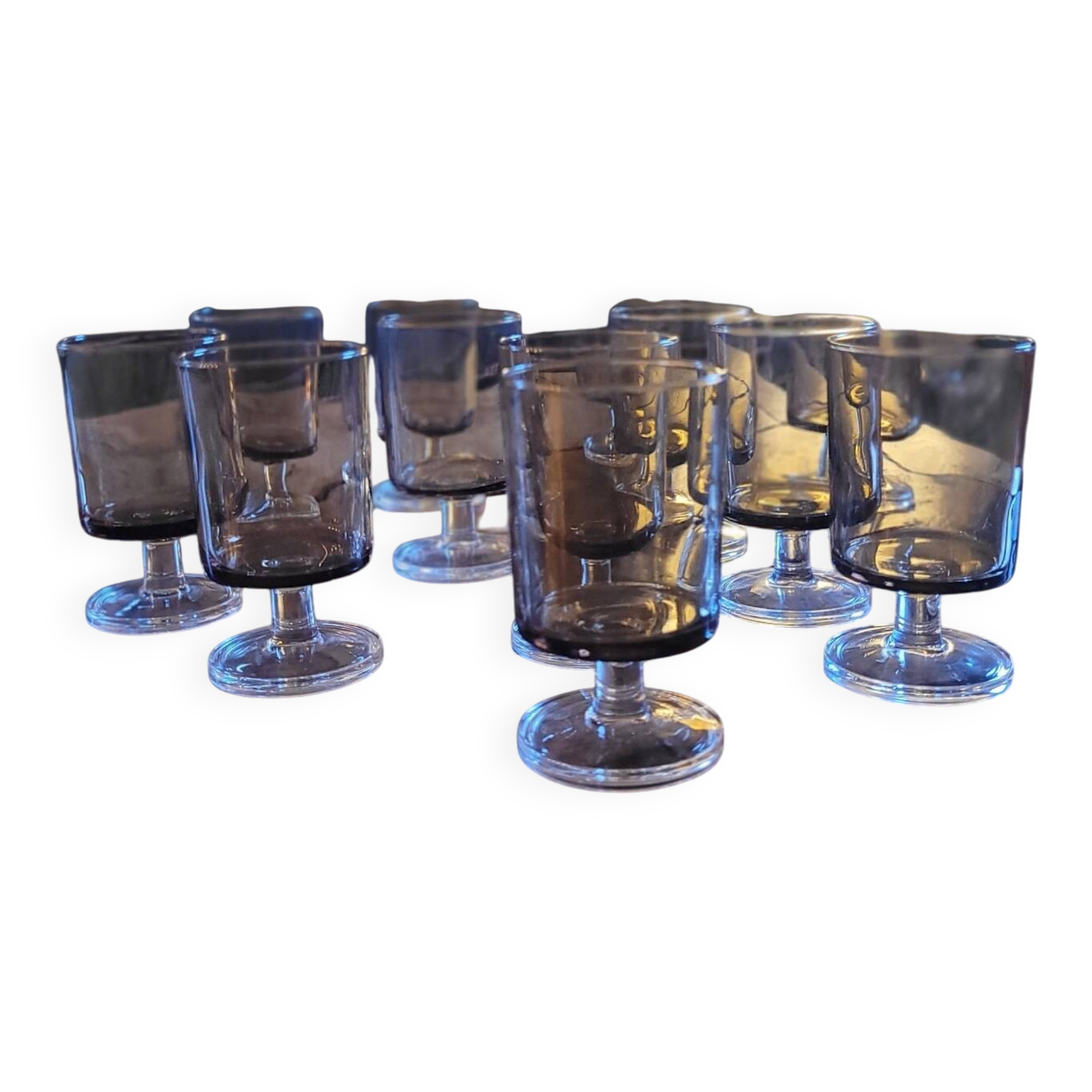 12 smoked glass stemmed glasses from the 70s and 80s.