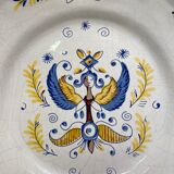Earthenware plate decorated with winged character decoration in Nevers style, Auxerrois