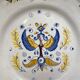 Earthenware plate decorated with winged character decoration in Nevers style, Auxerrois
