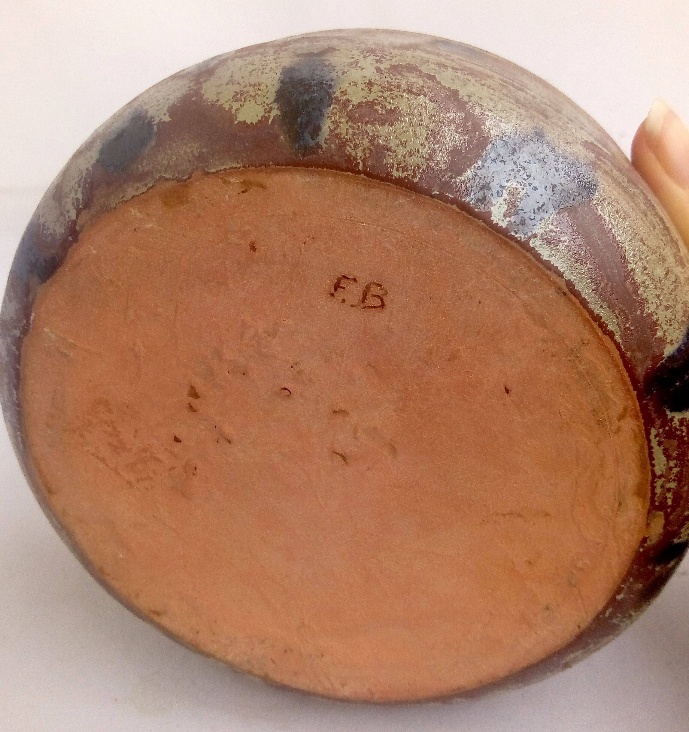 Rustic blue-spotted sandstone bowl