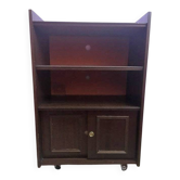 Vintage furniture bookshelf, TV or hi-fi system on wheels with sliding door.