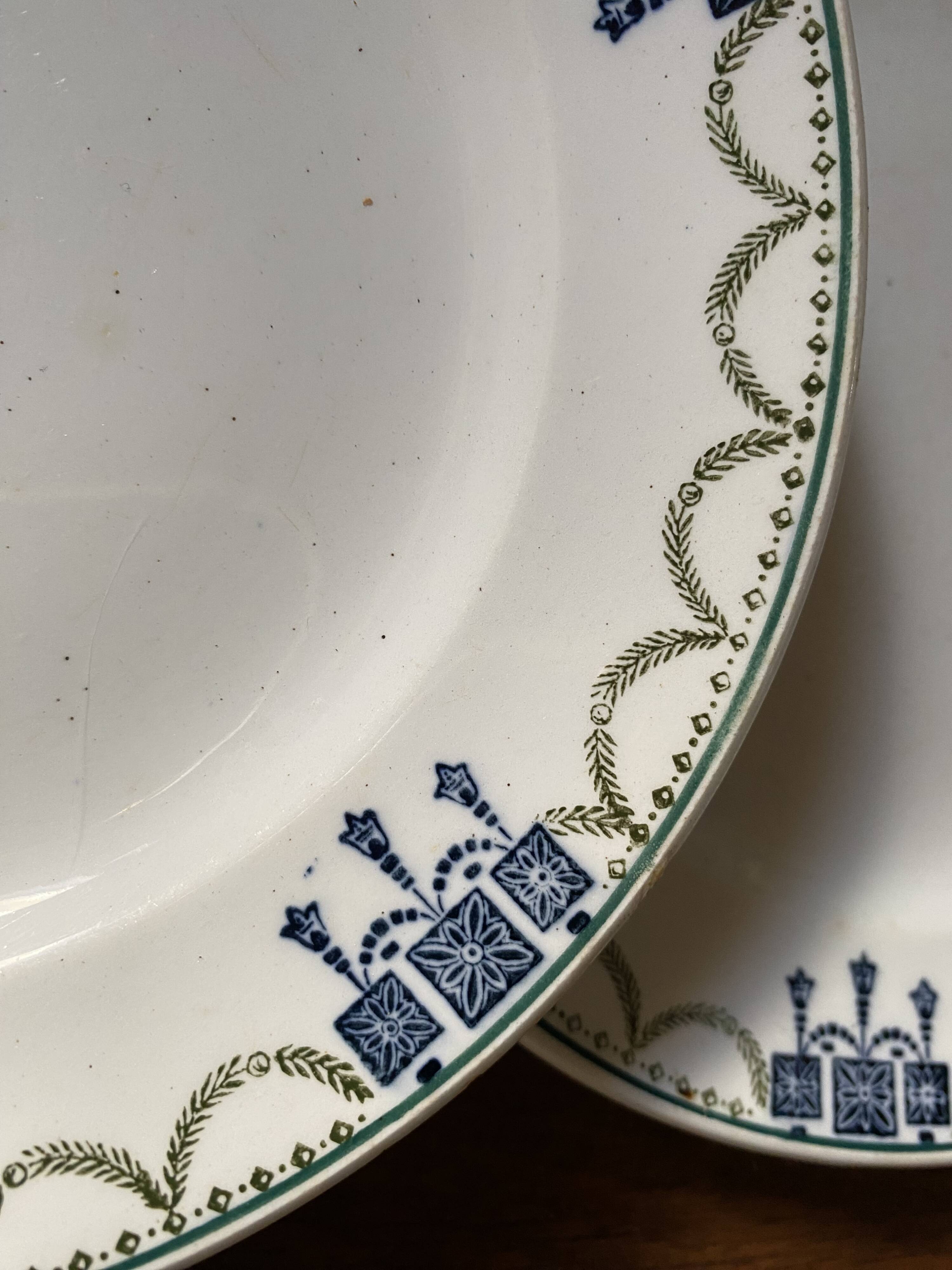 3 dessert plates stamped in art deco style.
