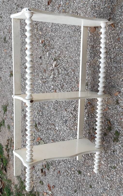 charming curved shelf with 2 turned wooden supports