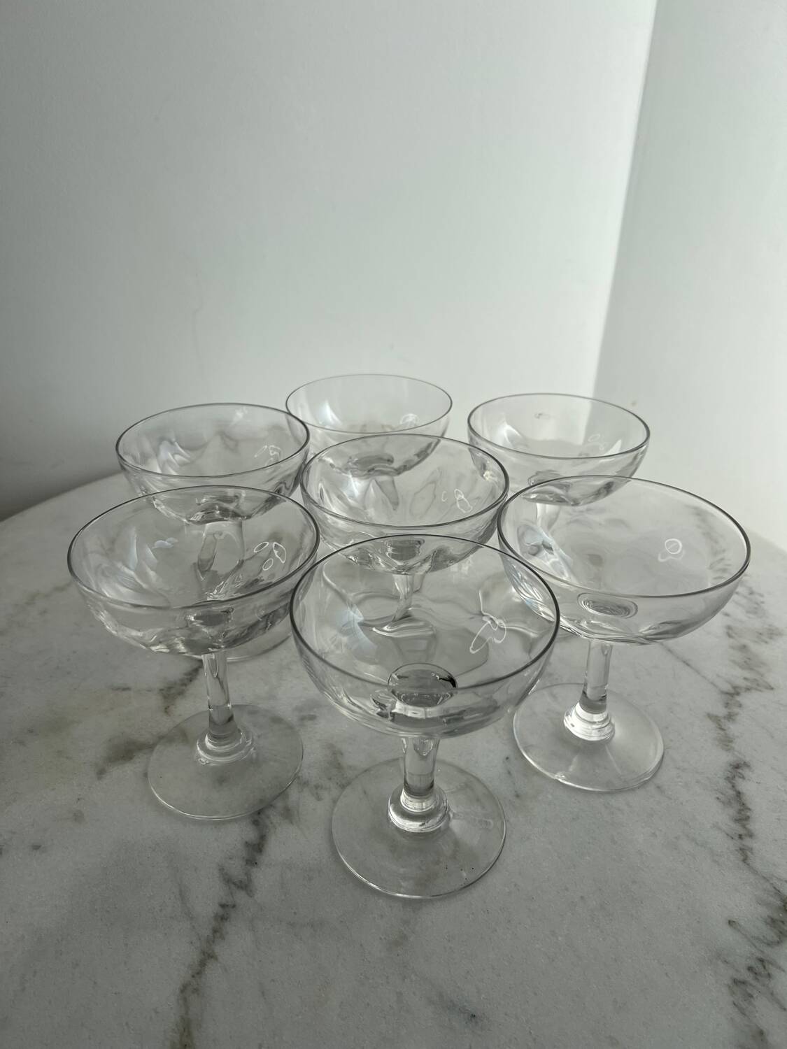 Set of seven blown glass stemmed glasses.