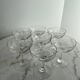 Set of seven blown glass stemmed glasses.